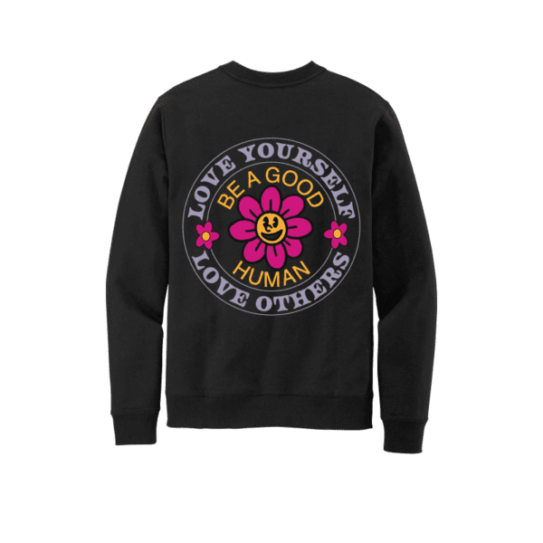 Crew neck sweater with flower on back.