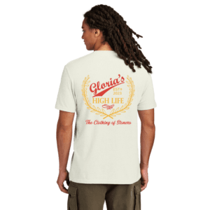 Man with braids wearing tee with graphic design on back.